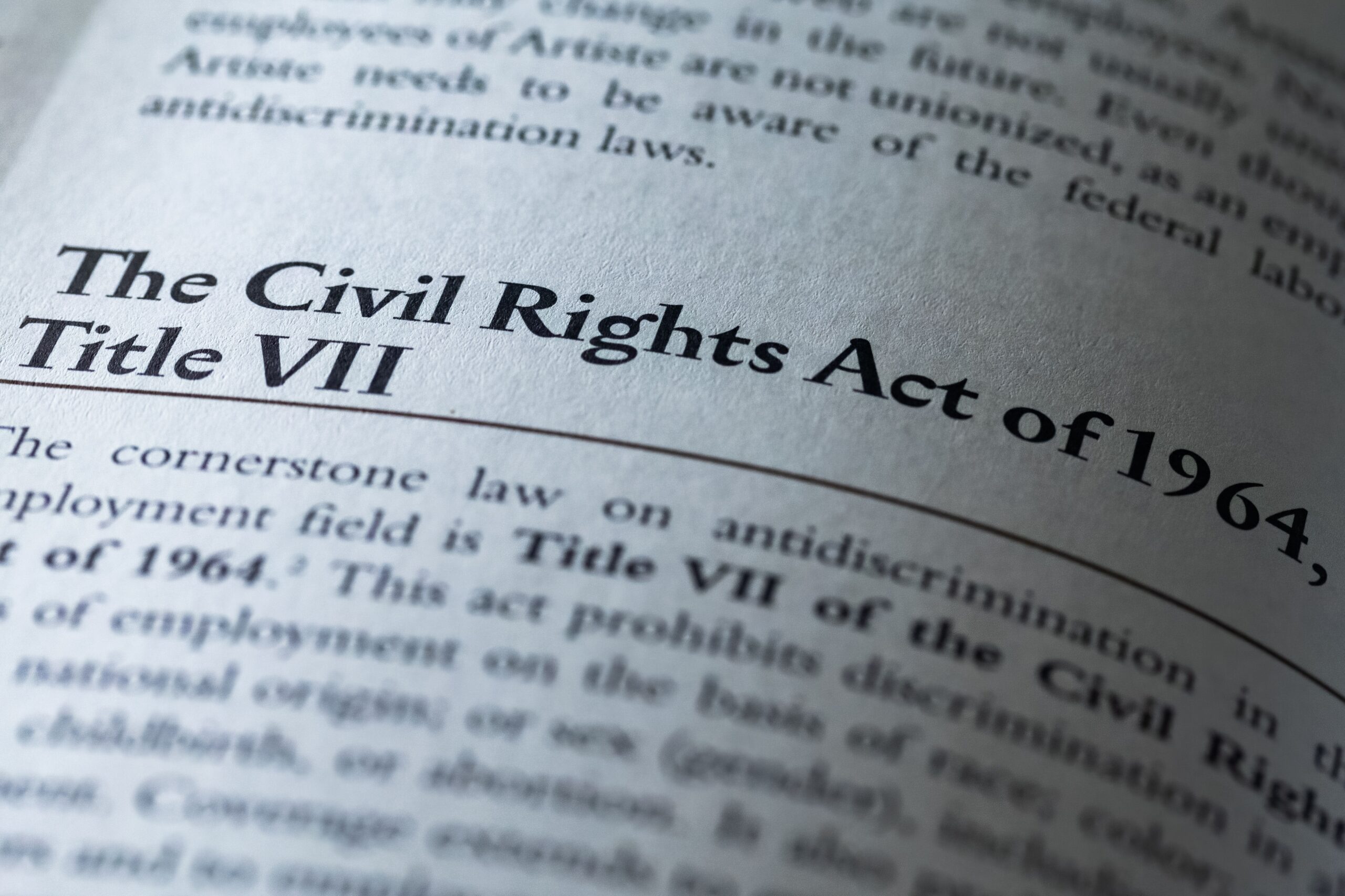 Civil Rights Act of 1964 Title VII written in business textbook